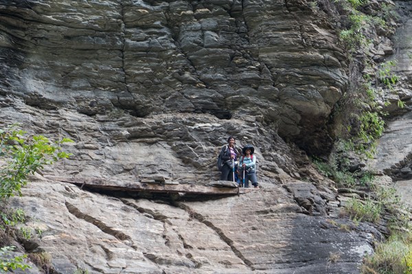 a-log-bridge-on-rocky-cliff