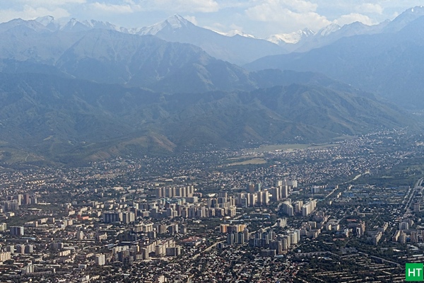 landing-at-almaty-airport-mountains-upfront